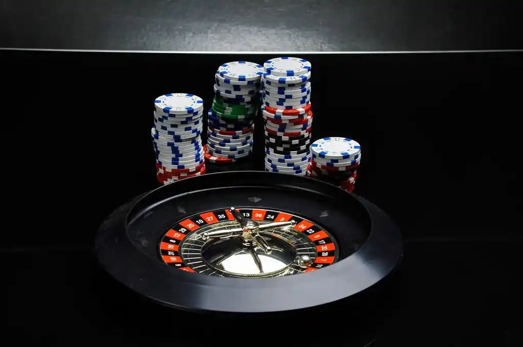 Filipino player placing a sports bet on table games from a smartphone showing live PBA odds
